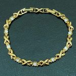 XOXO Vintage AVON Gold-tone Hugs & Kisses Rhinestones Tennis 8” Bracelet Photo 4