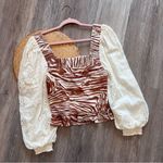 Anthropologie love the label zebra laser cut puff sleeve smocked blouse Photo 6