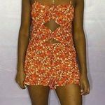 Dizzy Daze Orange Floral romper medium Photo 0