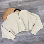 We Wore What Revolve  cropped crewneck sweatshirt khaki‎ Photo 4