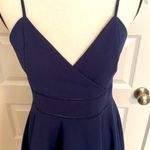 Jun & Ivy | Navy spaghetti strap sundress with embellishments at the waist. Photo 1