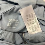 Lisa Rinna Asymmetrical Light Blue Shirt Horizontal and Lace Accents Photo 6