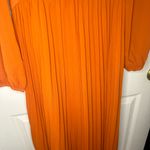 NWT women’s orange long sleeve, open sides dress Photo 3