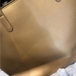 Neiman Marcus Gold Tote with Circular Design Photo 2