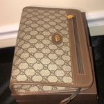 Gucci GG Supreme Clutch with Gold GG Zipper Pulls On Top Close and Front Pocket Photo 6