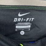 Nike  Dri Fit black & blue tie dye cropped capri leggings women’s size medium Photo 4