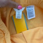 H&M  orange sweatshorts Photo 3