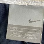 Nike  Blue Athletic Shorts with White Stripes Photo 3