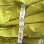 Lululemon women's high-rise leggings in neon yellow. Stretchy, Size 12 Photo 6
