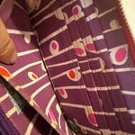 Pylones large "Voyage" wallet with a white flower/orchid pattern red Background Photo 4