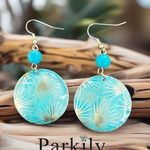 Patina metal earrings with a turquoise shade and gold on earwire Photo 1