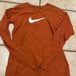 Nike Womens  burnt orange white long sleeve shirt Photo 0