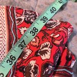 Free People  size 4 shark bite hem skirt red geometric zip back pockets on side Photo 4