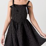 Trixxi Francesca’s black Paulene jacquard bow straps mini dress Photo 0