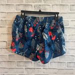 The North Face Women’s blue floral print 4” shorts Size Medium Photo 1