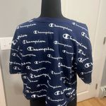 Champion logo all over graphic crop top Photo 3