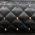 Betsey Johnson  | Quilted Black Bag w/ Iconic Skulls and Adjustable Buckle Strap Photo 2