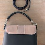 Good condition o pocket with 2 interchangeable flaps and handle. Black Photo 1