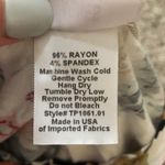 Agnes & Dora SMALL Soft Floral Relaxed Ruffle Hem Short Sleeve Top Photo 8