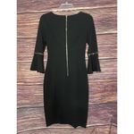 Calvin Klein Black Dress Size 2 Fitted with 3/4 Bell Sleeve With gold Rings. Photo 3