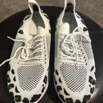 NWOT Step out in style with these chic white and black brown women's sneakers. Perfect for casual outings, these shoes offer both comfort and fashion. Size 10.5 never worn. Multiple Photo 1