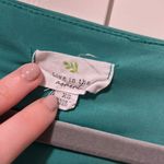 Live in the Moment Green Cap Sleeve Shirt Photo 1