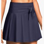 Iseegz. Women's High Waisted 15'' Swim Skirts Tummy Control Bathing Suit Skirt Bottoms Swimsuit with Liner Pockets Photo 0