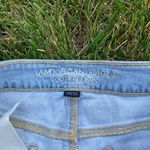 American Eagle AEO distressed jean shortie shorts lace trim light wash Size 6 Photo 1