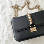 Valentino Garavani Valentino Rockstud Medium Glam Lock Flap Bag in Black Photo 0