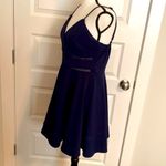 Jun & Ivy | Navy spaghetti strap sundress with embellishments at the waist. Photo 3