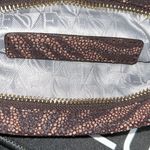 Diane Von Furstenberg  Animal Print Clutch
“Philomena” Photo 5