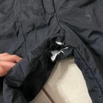 Skiing Black Overalls Photo 1