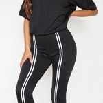 Pretty Little Thing  Black Loop Back Sports Striped Jumpsuit Photo 0