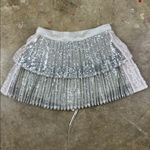 Flannel America Silver Sequin Pleated Skirt
Sz: 1 Size undefined Photo 2