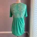 DKNY Jeans petites green burnout short sleeve hi low top hook and eye closure Photo 2