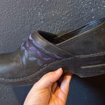 Dansko Women’s  Black Clogs with Purple Embroidered Detail Photo 2