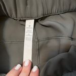 Lululemon On The Fly 7/8 Pants Woven Size 2 Grey Sage Photo 1