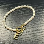 Initial āEā Letter Gold And Pearl Bracelet Photo 1
