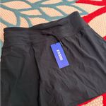 Iseegz. Women's High Waisted 15'' Swim Skirts Tummy Control Bathing Suit Skirt Bottoms Swimsuit with Liner Pockets Photo 9