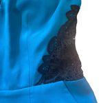 Bebe  women's size small blue with black lace v-neck romper Photo 1