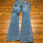 American Eagle  stretch flare jeans with blue embroidery‎ size 4 cowgirl vibes Photo 2