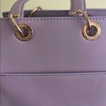 Trina Turk double handle tote in lilac with a removable crossbody strap Photo 11