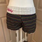 Billabong vintage black rainbow striped board swim shorts with white trim. M. Photo 4