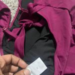 Stylish burgundy swimsuit with ruffled straps. Perfect for a chic beach look. Purple Size XL Photo 7