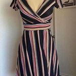 Cute black, pink, and yellow striped faux wrap dress. Black Photo 0