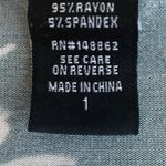 Torrid -WOMENS SIZE 1X-GREEN FLORAL BABYDOLL TOP Super soft knit, button front, super stretchy, 3/4 sleeves, great condition Measurements: Bust: armpit to armpit 24 inches Length: shoulder seam to bottom Front 29 inches Back. 32 inches Photo 5