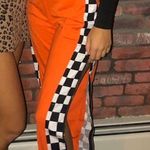 Amazon Orange Joggers With Racecar Stripe  Photo 0