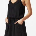 Forever 21  Women’s Casual Flowy Romper with Pockets and Macrame Accents Photo 0