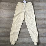 Dippin' Daisy's NWT Dippin’ Daisy’s Yellow Smile Sweatpants Size Small Photo 1