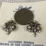 Vintage clip Brookcraft earrings new on card. Silver Photo 1